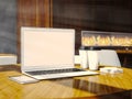 Set of generic design laptop, businesscards, smartphone and blank coffe cups on the table in modern restaurant interior