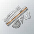 Protractor, a wooden ruler, and two set squares (45-45-90 and Royalty Free Stock Photo