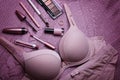 Set of glamorous stylish dusty pink sexy lingerie with woman accessories and cosmetics.