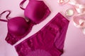 Set of glamorous stylish sexy lingerie with cosmetic products, on a pink background. Shopping fashion and self care Royalty Free Stock Photo