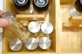 Set of glass jars for bulk spices. In a wooden bamboo box