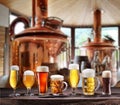 Set of glasses of different beer on wooden table and blurred copper brewing system at the background Royalty Free Stock Photo