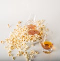 Set of glasses of single malt whisky, salty popcorn in a bowl an