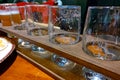 Set of glasses for tasting beer on wooden stand. Different types of beer Royalty Free Stock Photo