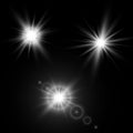 Set of glowing light effects with transparency isolated on black background. Lens flares, rays, stars and sparkles with bokeh Royalty Free Stock Photo