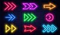 Set of glowing neon arrows. Glowing neon arrow pointers on brick wall background. Retro signboard with bright neon tubes Royalty Free Stock Photo