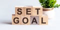 Set Goal Motivational Text on a wooden background Royalty Free Stock Photo