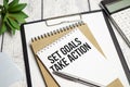 Set Goals, Take Action. text on white paper Royalty Free Stock Photo