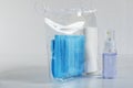 Set for going out in the conditions of COVID-19 in a vacuum package. Medical gloves, medical mask, disinfectant in an aerosol can. Royalty Free Stock Photo