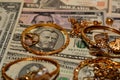 A set of gold accessories of rings, chains and bracelets on American dollars banknotes money of different values