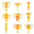 A set of gold cups of different forms to award the winners. Prizes for the first place in competitions and contests Royalty Free Stock Photo