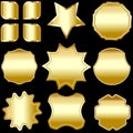 A set of gold framed badges, labels and shields, isolated on black. Royalty Free Stock Photo