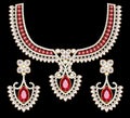 set of gold glittering choker necklace and earrings with precious stones