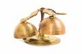 Set of gold handbells on white background