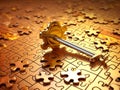 set of gold puzzles with a key. the concept of solving different problems with the help of an idea and the right choice. puzzle