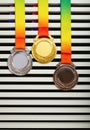 a set of gold silver and bronze award medals hanging up vertical composition Royalty Free Stock Photo