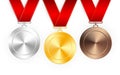 Set of gold, silver and bronze award medals with red ribbons. Medal round empty polished vector collection isolated on white Royalty Free Stock Photo