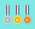 Set of gold, silver, bronze medal with star for first place. Trophy, award for winner isolated on blue background. Golden badge Royalty Free Stock Photo