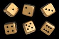 Set of golden dice with black dots isolated on black background Royalty Free Stock Photo