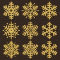 Set of golden glittering snowflakes line stile over brown wooden