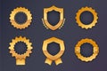 Set of golden shields with ribbons on dark background. Vector illustration Royalty Free Stock Photo