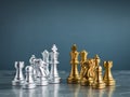 Set of golden and silver chess pieces element, king, queen rook, bishop, knight, pawn standing on hexagon pattern. Royalty Free Stock Photo