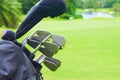 Set of golf clubs over green field background Royalty Free Stock Photo