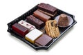 A set of gourmet cakes and desserts packaged for takeaway. Takeaway food. Isolated on a white background