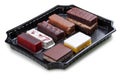 A set of gourmet cakes and desserts packaged for takeaway. Takeaway food. Isolated on a white background