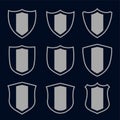Set of gray shield symbols and signs