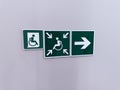 Set of green signs with arrows indicating direction of way for wheelchair users. Accessibility issues are addressed through Royalty Free Stock Photo