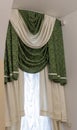 set of green and white curtains with an attached valance and tiebacks. Interior Royalty Free Stock Photo