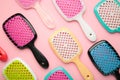 Set of hairbrushes on pink background. Flat lay Royalty Free Stock Photo