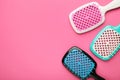 Set of hairbrushes on pink background. Space for text Royalty Free Stock Photo