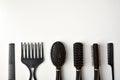 Set of hairbrushes of various uses on white table Royalty Free Stock Photo