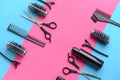 Set of hairdresser tools and accessories on color background