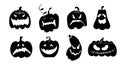 Set of Halloween pumpkins silhouettes with spooky smiles. Black icons isolated on white background Royalty Free Stock Photo
