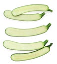 Set with halves of fresh zucchinis on white background, top view