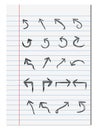 Set of hand drawn arrows on notebook paper background