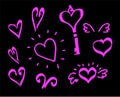A set of hand-drawn Doodle elements hearts and keys with swirls and wings in bright pink on a black background isolated Royalty Free Stock Photo