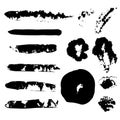 Set of hand drawn grunge strokes. Black ink brush strokes and blots Royalty Free Stock Photo