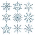 Set of hand drawn lacy blue snowflakes on a white background. Winter design elements