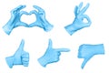 Set of hand or signs gestures in blue disposable latex surgical gloves isolated on white background