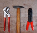 Set Hand Tools with Hammer, pincers, screwdriver, on wooden background Royalty Free Stock Photo