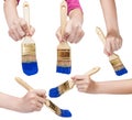 Set of hands with flat paint brush with blue tip