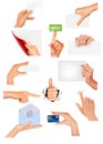 Set of hands holding different business objects. Royalty Free Stock Photo