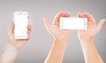 Set hands holding empty blank screen mobile phones on gray background, vertical and horizontal empty display