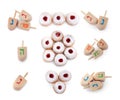 Set with Hanukkah traditional dreidels and doughnuts on white background, top view Royalty Free Stock Photo