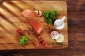 Set of Healthy anticancer food on wooden table. Red salmon fish, broccoli, garlic, milk, pepper and tomatoes scattered