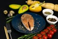 A set of healthy balanced super food, Salmon steak on a beautiful blue plate, vegetables